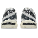 Pair of silver and black athletic shoes on a white background