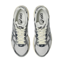 Pair of gray and white sneakers with visible Asics logo on a white background
