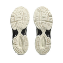 Close-up of a pair of shoes with white soles on a white background