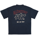 A navy blue short-sleeve t-shirt shown from the back, featuring a graphic print with the word 'Atterror' in red, white line drawings of hands holding a gun, and the phrase 'We ate first' in white gothic font.