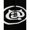 Close-up of a black hoodie with a white logo on a white background