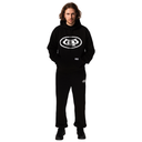 Person wearing a black hoodie and pants with a logo on a white background