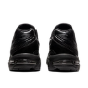 Black athletic shoes shown from the back on a white background