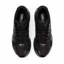 Black Asics sneakers on a white background