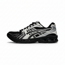 A single Asics running shoe in black, white, and gray, shown from a side profile view against a plain white background.