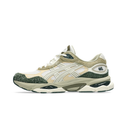 A single Asics sneaker shown from the side profile against a solid white background. The shoe features a cream and beige upper with textured green suede overlays, a green speckled toe cap, and a chunky beige and green midsole.
