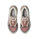 A pair of Asics sneakers shown from a top-down view on a plain white background. The shoes feature a color-blocked design in dusty rose, cream, and black, with the Asics logo visible on the tongue and insole.