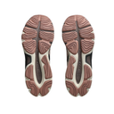 A pair of athletic sneakers shown from the sole view, featuring a chunky design with a dusty rose-brown and off-white wavy tread pattern and dark gray accents.