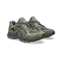 A pair of Asics trail running shoes in olive green and dark gray, shown from a three-quarters angle on a white background.