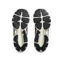 A pair of athletic sneakers shown from the sole view, displaying black and off-white cushioned tread patterns on a clean white background.