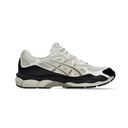 A single Asics sneaker shown in profile against a solid white background. The shoe features a cream and white mesh upper with black overlays, beige side stripes, and a chunky black and cream midsole.