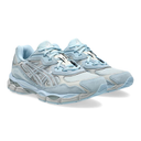 Pair of light blue and gray sneakers on a white background