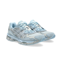 A pair of light blue and silver athletic sneakers shown from a three-quarters angle on a clean white background.