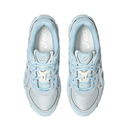 Light blue sneakers with white soles on a white background