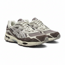 Pair of gray and beige sneakers on a white background