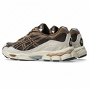 Pair of brown and beige sneakers on a white background