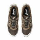 Pair of brown sneakers with white soles on a white background