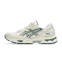 White running shoe with green accents on a white background