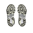 Close-up of a pair of running shoes with focus on sole design on a white background