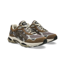 A pair of Asics athletic sneakers in brown, beige, and gray, shown from a three-quarters angle on a white background.