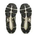 A pair of athletic shoes shown from the sole view, featuring a dual-density tread pattern with black rubber and a light beige midsole.