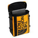 The North Face backpack shown open with a laptop inside, featuring a bold yellow and black design with the brand's logo printed vertically on the front.