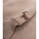 Close-up of a beige sweater with a brown embroidered deer design on a white background