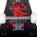 Close-up of a skateboard with red graphics and white wheels on a black background