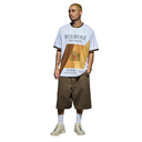 A man modeling an oversized graphic t-shirt and brown shorts against a plain white background. The t-shirt is white with a large gold and brown graphic on the front featuring the text 'BXR SPORT Worldwide' and 'ON THE WAY'.