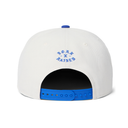 White snapback cap shown from the back, featuring a blue embroidered circular logo on the back panel and a bright blue adjustable strap.