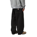 Person wearing black pants and a gray sweatshirt on a white background