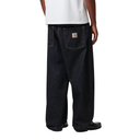 Person wearing black pants with a visible brand logo on a white background