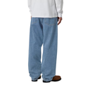 A person shown from the back wearing light blue wide-leg denim jeans, a white long-sleeve shirt, and brown shoes against a plain white background.