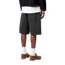 Person wearing black denim shorts, white socks, and brown shoes on a white background