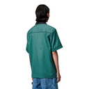Person wearing a green shirt on a white background