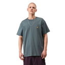 Person wearing a gray t-shirt with a small logo on a white background