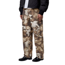 Person wearing camouflage pants with a black jacket on a white background