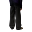 Black pants worn by a person on a white background