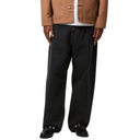 Person wearing a brown jacket, white shirt, black pants, and black shoes on a white background