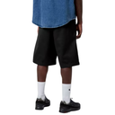 Person wearing black shorts, white socks, and black shoes on a white background