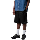 Person wearing black shorts, white socks, and black shoes on a white background