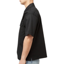 Person wearing a black short-sleeve shirt on a white background