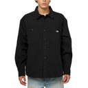A model wearing a black long-sleeve button-up shirt with two chest pockets and a small Dickies logo on the left chest, paired with light blue jeans against a white background.