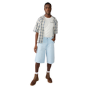 Man wearing a plaid shirt, white t-shirt, light blue shorts, and brown boots on a white background