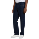 Person wearing dark blue jeans and white sneakers on a white background