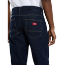 Dark blue jeans with a visible brand logo on the back pocket against a white background