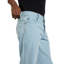 Light blue jeans worn by a person on a white background