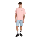 Person wearing a pink t-shirt and light blue shorts on a white background