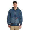 A man wearing a blue denim zip-up hooded jacket with a front kangaroo pocket and ribbed cuffs, paired with tan pants, against a plain white background.