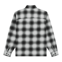 A long-sleeve plaid overshirt shown from the back, featuring a black and white gradient checkered pattern, a band collar, and buttoned cuffs.
